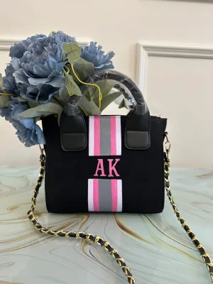 Black mini bag with white, pink and grey stripes